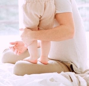 baby on fathers lap