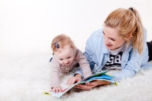 mother reading book to her child